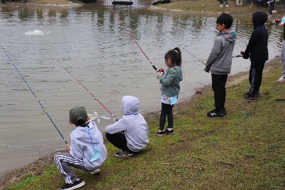Young anglers on a shore fishing